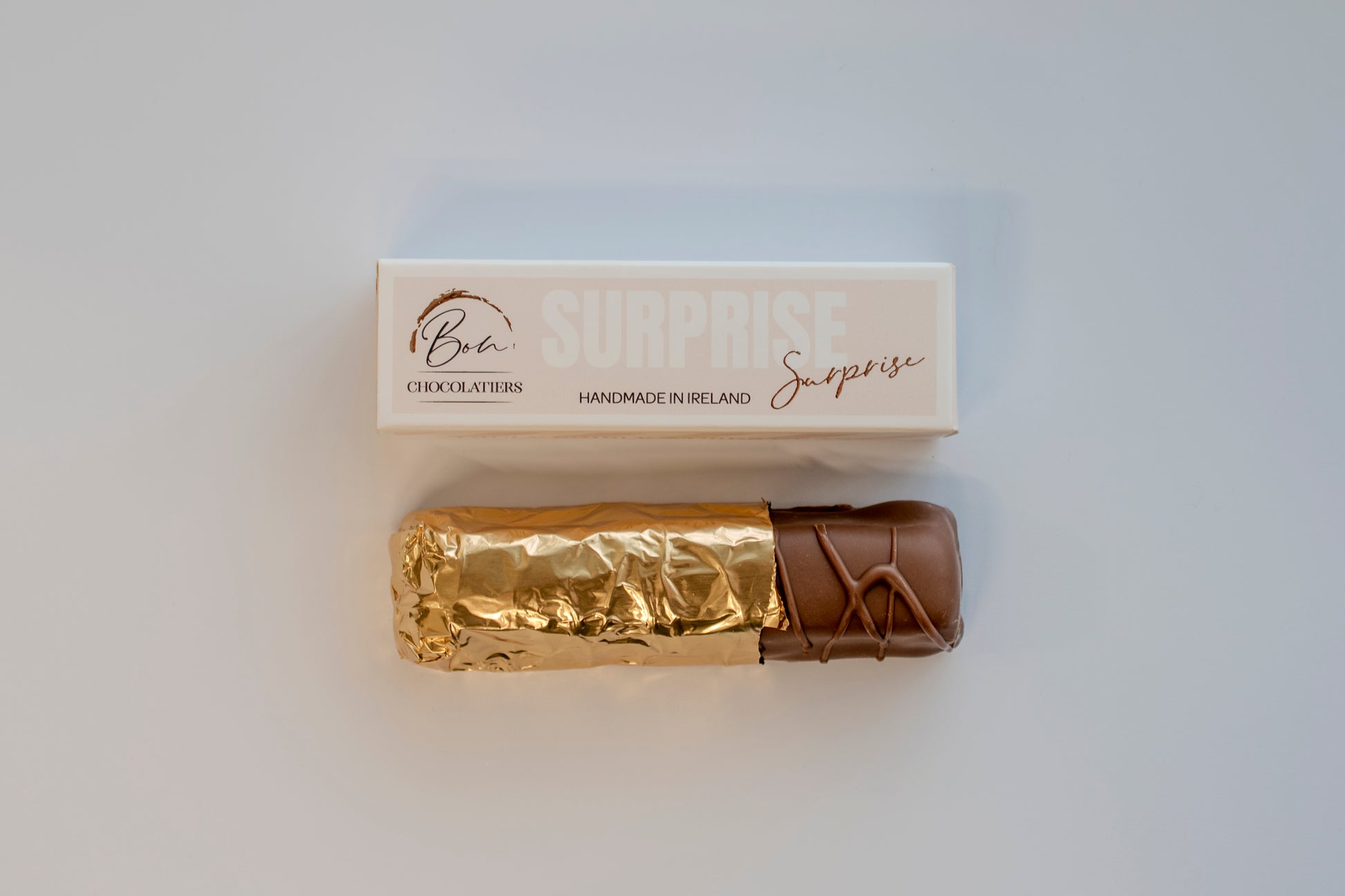 Gold-wrapped artisan Irish Surprise Bar by Bon Chocolatiers, a luxury gifting idea for him on any occasion.